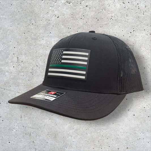 Thin Green Line Hat with textured American flag patch, Richardson 112 trucker style, perfect for military and patriotic support.